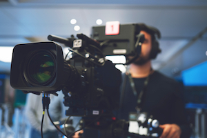 hybrid events require live camera equipment and staff Hybrid events with cameraman filming