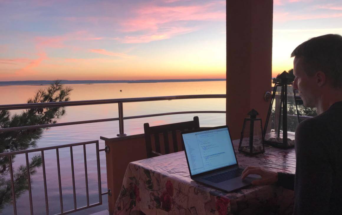 Remote work overlooking ocean sunset