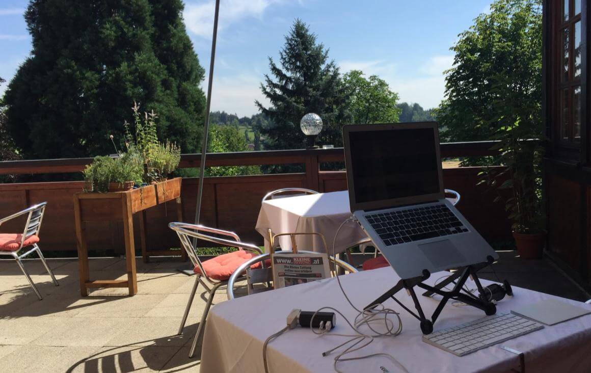 Working remote from a terrace in the summer